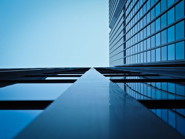 Low Angle View of Office Building Against Clear Sky - Download Free Stock Photos Pikwizard.com