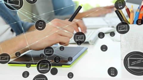 Man Using Graphics Tablet in Creative Workspace