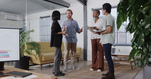 Diverse team discussing strategy in modern office setting