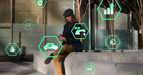 Man checking smartphone on urban plaza with green sustainability and smart city icons