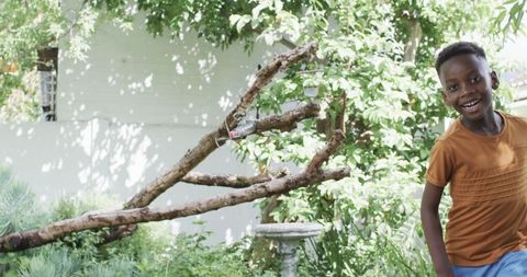 Happy Boy Playing Outdoors in Nature's Glow