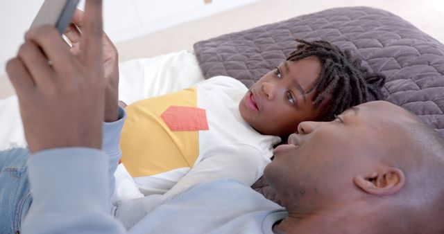 Father and Daughter Using Tablet Together on Bed - Download Free Stock Images Pikwizard.com