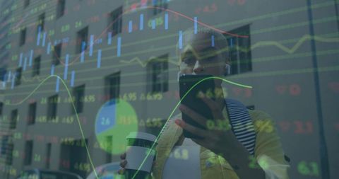 Businesswoman checking stocks on smartphone while walking in city