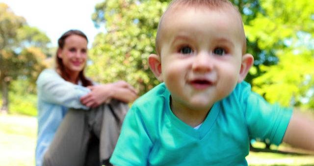 Curious Baby Crawling in Park as Mother Watches - Download Free Stock Images Pikwizard.com