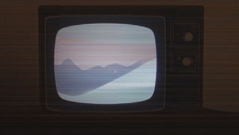 Retro CRT Television Showing Pastel Mountain Landscape with Visible Scanlines