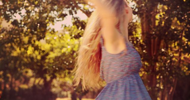 Blonde Woman Twirling in Blue Dress Outdoors - Download Free Stock Images Pikwizard.com