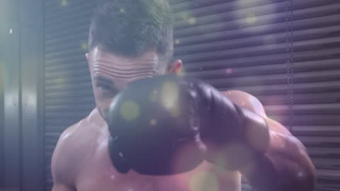 Boxer Practicing Punches at Gym with Dynamic Lighting Effect