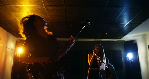 Rock Band Performing in Recording Studio with Vibrant Lighting - Download Free Stock Images Pikwizard.com