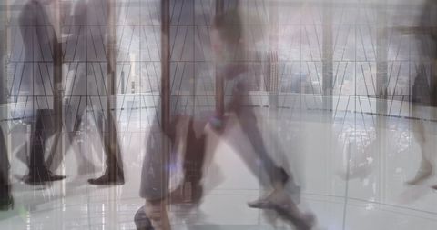 Business professionals walking through modern office atrium with dynamic motion blur