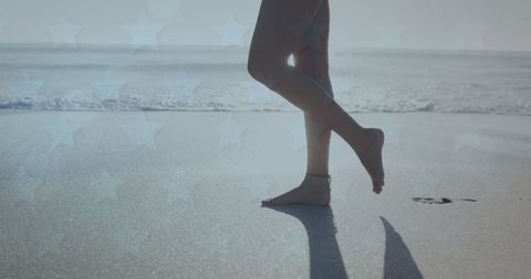 Woman on Sandy Beach Steps at Sunrise