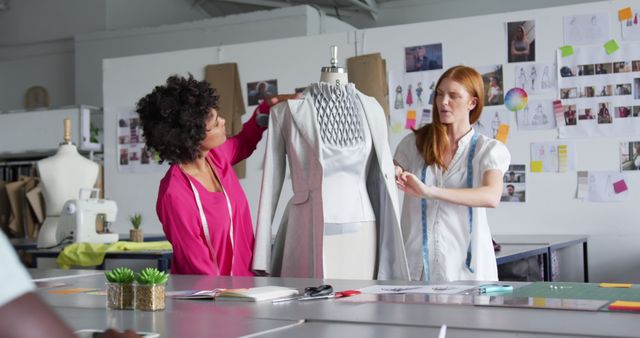 Two Women Collaborating on Fashion Design in Studio Workspace - Download Free Stock Images Pikwizard.com