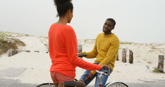 Couple Enjoying Leisure Time Biking at Beach - Download Free Stock Images Pikwizard.com