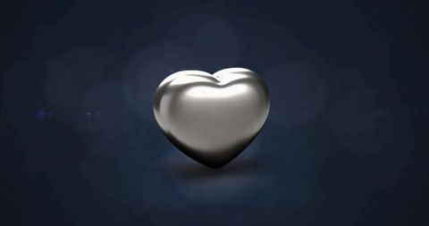 Floating Metallic Heart Reflecting Soft Bokeh Lights for Luxury, Tech and Romantic Design