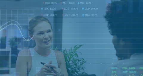 Colleagues Discussing Work with Financial Data Analyst Background