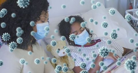 Mother and daughter in hospital with virus cells overlay