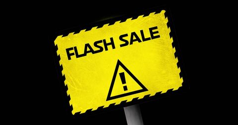 Bright Yellow Flash Sale Alert Sign on Black Background