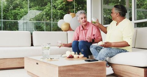 Joyful Senior Couple Enjoying Summer Celebration with Cake