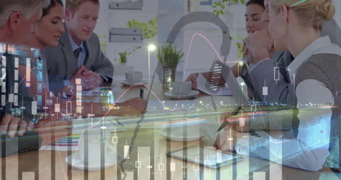 Diverse Business Team Analyzing Data Overlaid with Analytics