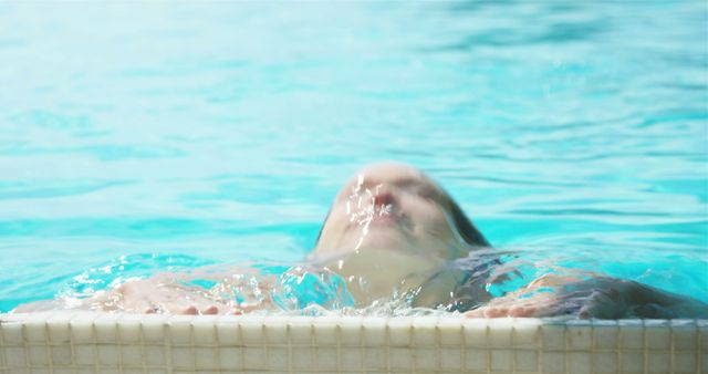 Person Refreshing in Swimming Pool Water with Bright Backdrop - Download Free Stock Images Pikwizard.com