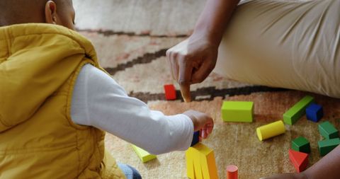 Father and Son Engaged in Creative Block Building at Home - Download Free Stock Images Pikwizard.com