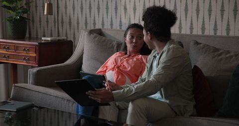 Couple Engaging in Cozy Living Room Conversation