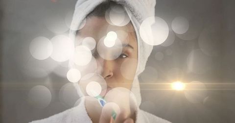 Woman Practicing Oral Hygiene in Luxurious Spa Setting