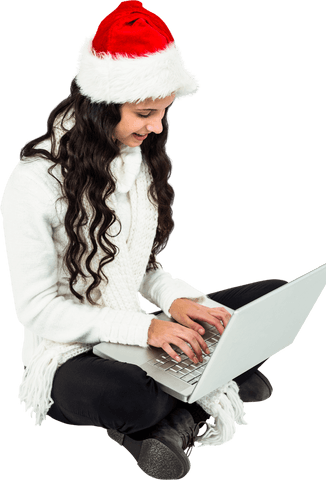 Young woman in santa hat using laptop on transparent background
