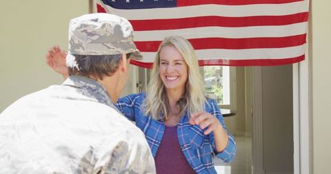 Soldier Embracing Partner Under American Flag