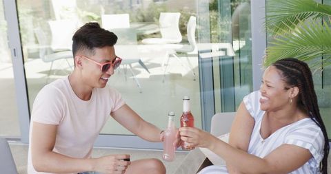 Diverse Friends Toasting with Bottled Drinks Outdoors