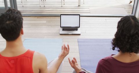 couple meditating with online yoga class at home - Download Free Stock Images Pikwizard.com