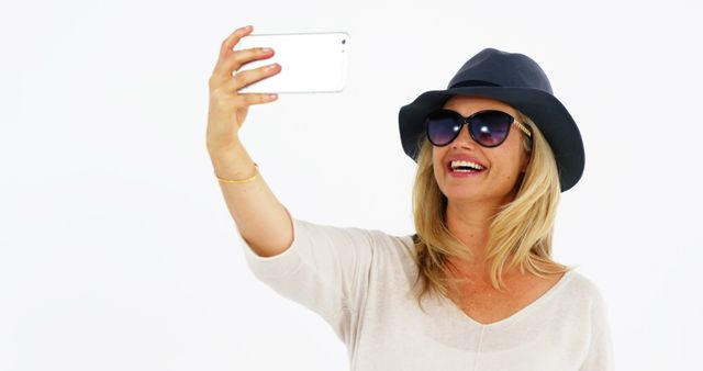 Stylish Woman Taking Selfie with Smartphone in Casual Outfit - Download Free Stock Images Pikwizard.com