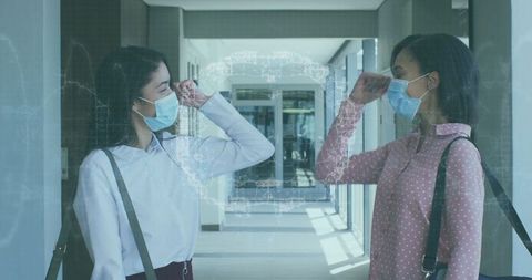 Businesswomen Wearing Masks Greet in Office With Digital Brain Overlay