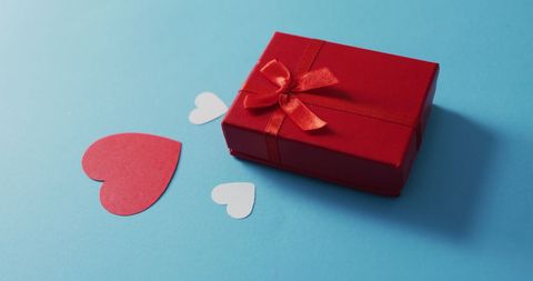 Red Gift Box on Blue Background with Heart Cutouts - Download Free Stock Images Pikwizard.com