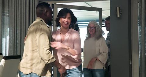 Diverse Group Therapy Session Participants Arriving with Smiles