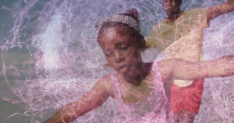 Young girl balancing on beach with glowing light trails, double exposure family moment
