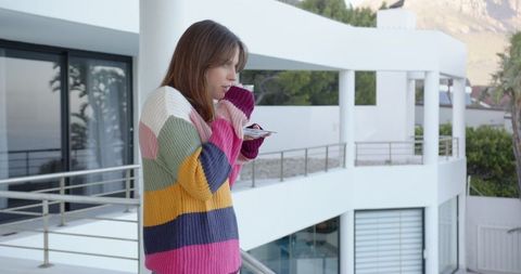 Woman Enjoying Coffee on Modern Balcony Leisure Lifestyle