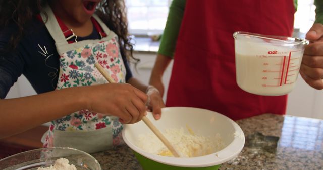 Family Baking Time - Mother and Daughter Preparing Dough Together - Download Free Stock Images Pikwizard.com