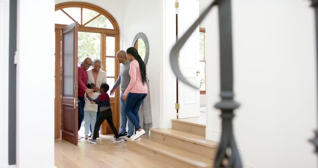 Happy Family Welcoming Guests into Home - Download Free Stock Images Pikwizard.com