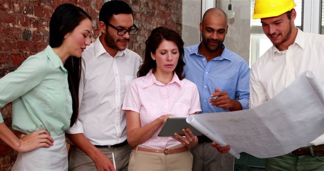 Diverse Group of Professionals Collaborating on Project Plans - Download Free Stock Images Pikwizard.com