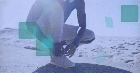 Runner tying shoes in futuristic digital overlay