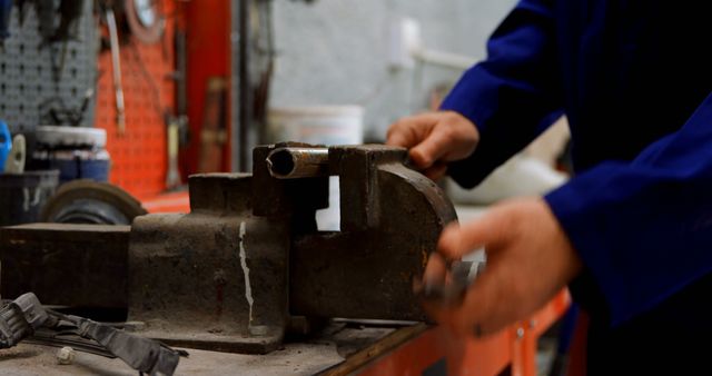 Close-Up of Technician Using a Vise in Workshop - Download Free Stock Images Pikwizard.com