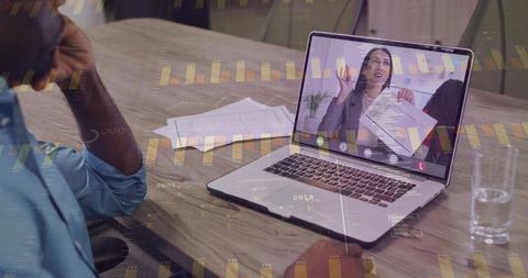 Virtual collaboration on laptop with businesswoman presenting documents and analytics