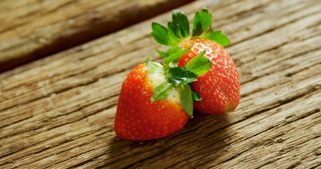 Close-up of strawberries placed on wooden surface 4K 4k
