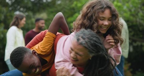 Multigenerational Family Enjoying Outdoor Playtime in Garden