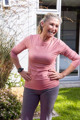 Active Senior Woman Enjoying Outdoor Exercise in Backyard