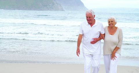 Senior Couple Enjoying Beach Walk with Scenic View - Download Free Stock Images Pikwizard.com