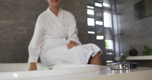 Woman Relaxing in White Bathrobe Near Bathtub in Modern Bathroom - Download Free Stock Images Pikwizard.com