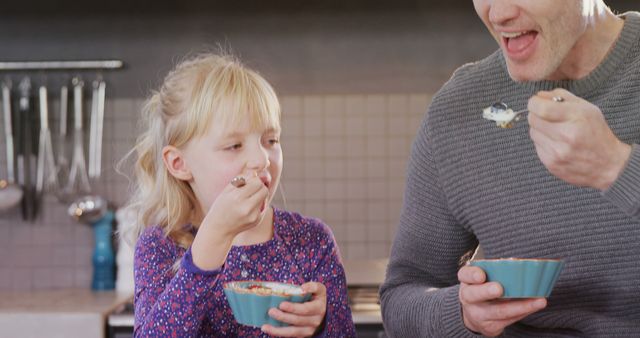 Father and Daughter Eating Breakfast Cereal Together - Download Free Stock Images Pikwizard.com