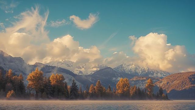 Autumn Forest by Tranquil Mountain Lake at Sunrise