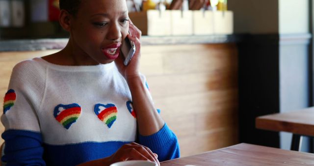 Confident Woman Talking on Phone in Coffee Shop - Download Free Stock Images Pikwizard.com